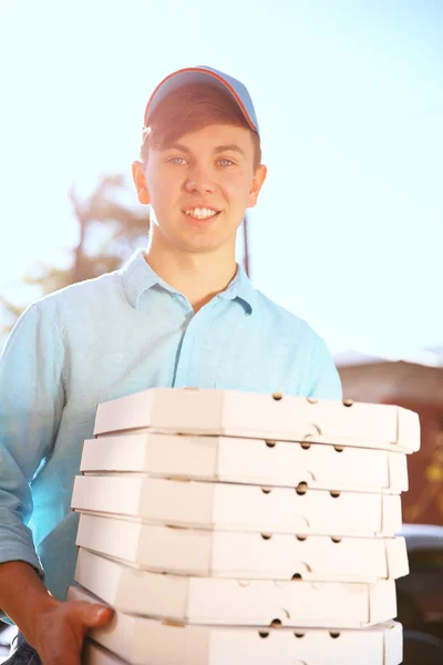 Delivery boy with pizza boxes — Stock Photo, Image