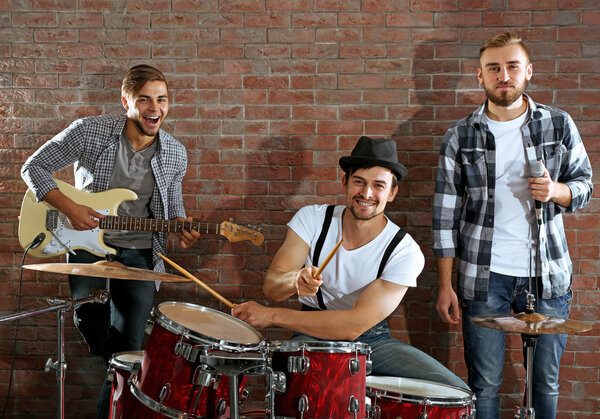 Musicians playing drums and guitar