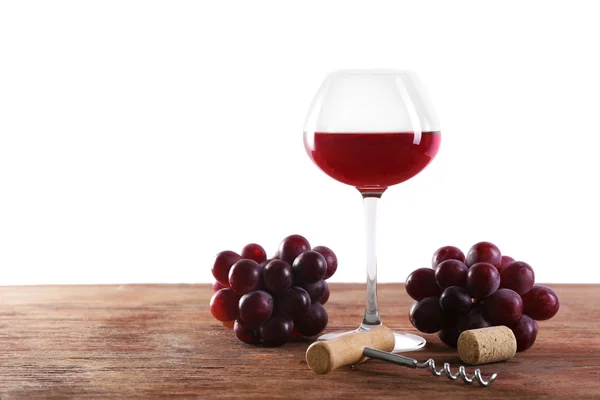 Víno a hroznovou na dřevěný stůl — Stock fotografie
