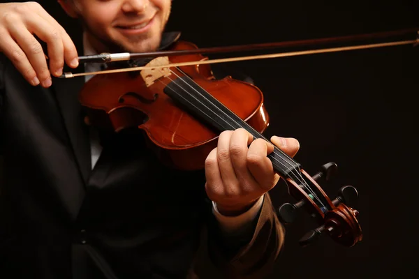 Musician plays violin on black background, close up — Stock Photo, Image