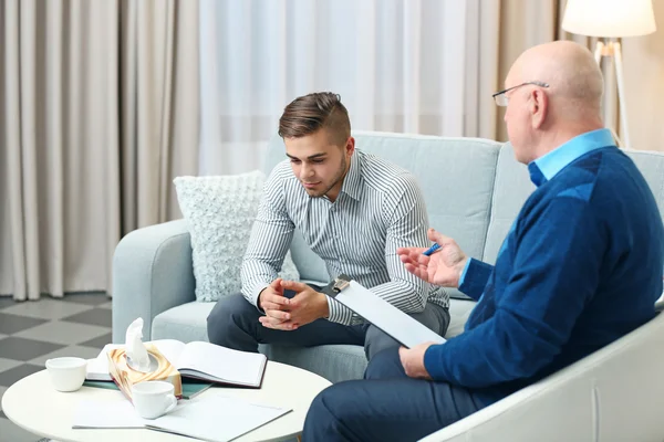 Young man at psychologist — Stock Photo, Image