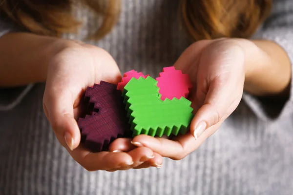 Plastic puzzle hearts — Stock Photo, Image