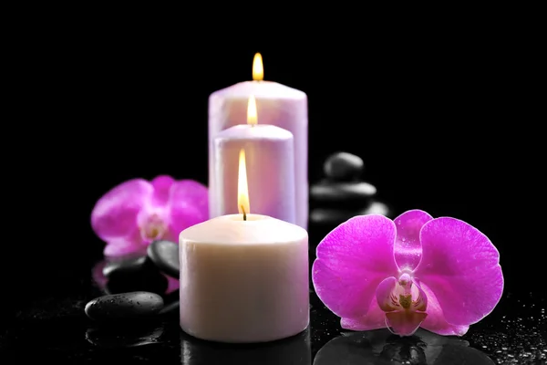 Flowers with lighted candles — Stock Photo, Image