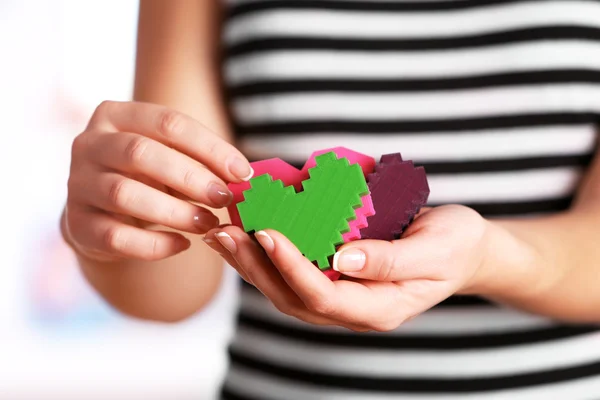 Plastic puzzle hearts — Stock Photo, Image