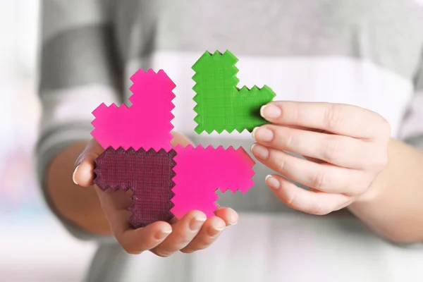 Plastic puzzle hearts — Stock Photo, Image