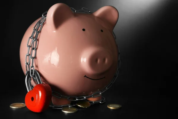 Piggy bank and chains — Stock Photo, Image