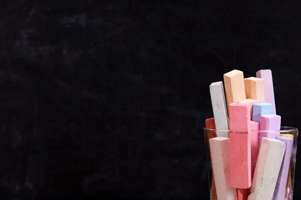 Glass of coloured chalk — Stock Photo, Image