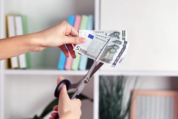 Hands with scissors cutting Euro — Stock Photo, Image