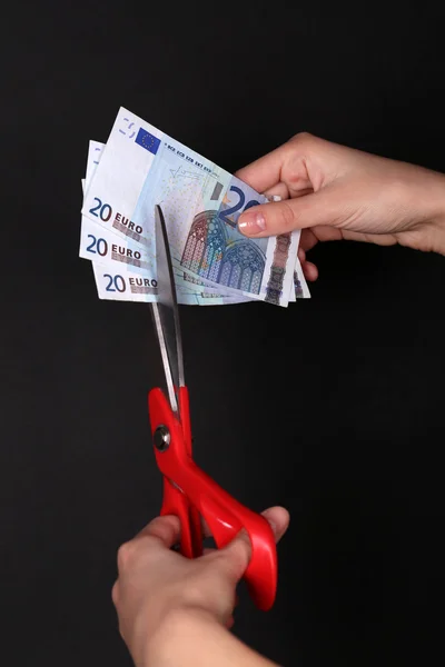 Hands with scissors cutting Euro — Stock Photo, Image