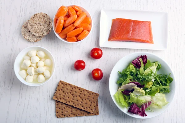 Healthy foods on light wooden background. healthy eating concept. — Stock Photo, Image