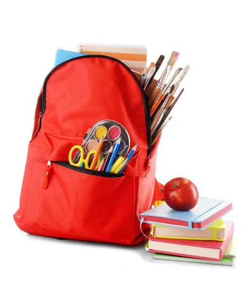 Red backpack with books and apple — Stock Photo, Image