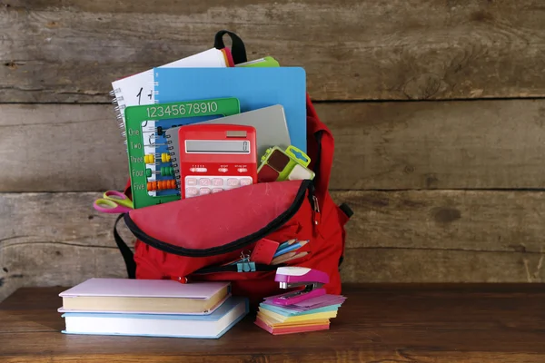 Backpack with school supplies — Stock Photo, Image