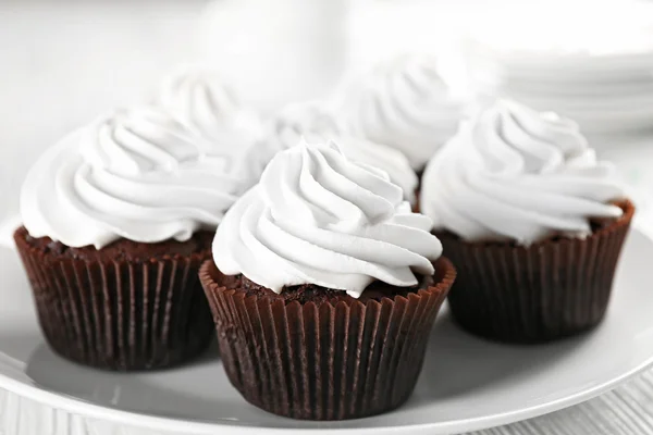 White cupcakes on wooden table — Stock Photo, Image