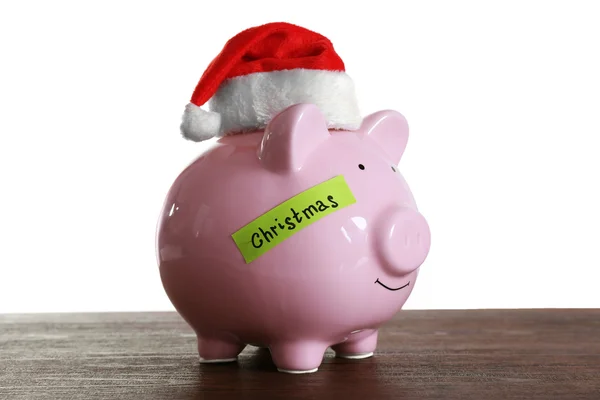 Piggy bank with Santa hat — Stock Photo, Image