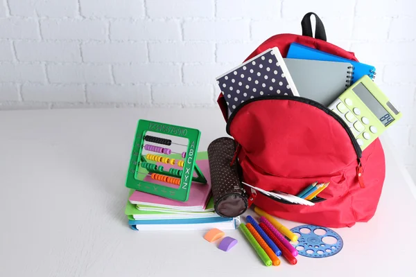 Backpack with school supplies — Stock Photo, Image