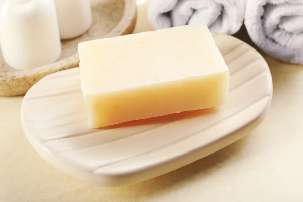 Soap on a dish with towels — Stock Photo, Image