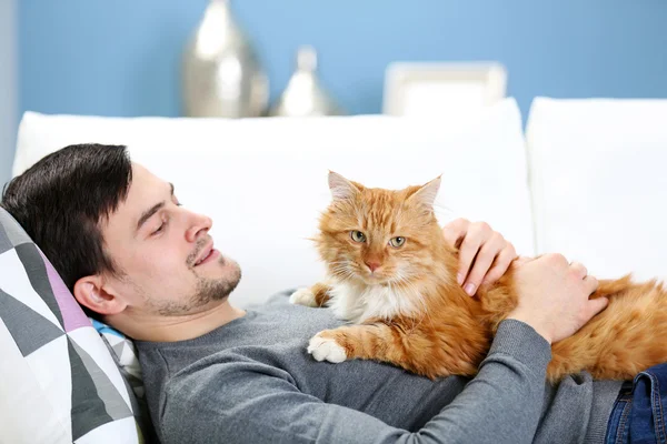man with fluffy cat
