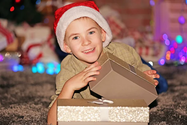 Little boy with gift boxes — Stock Photo, Image