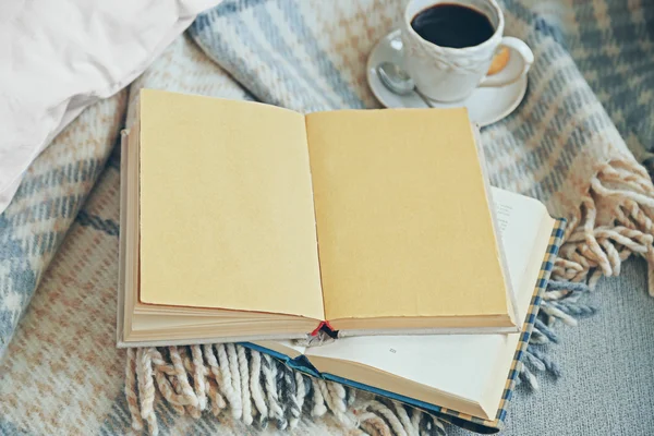 Open book, plaid and coffee Stock Image