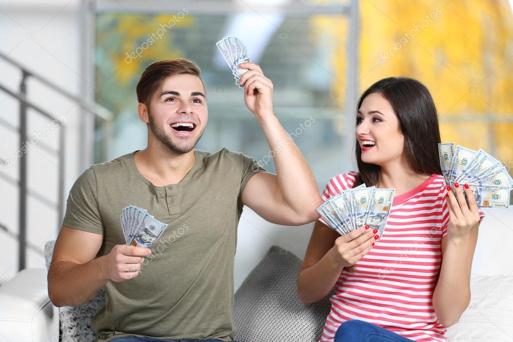 Happy couple with money