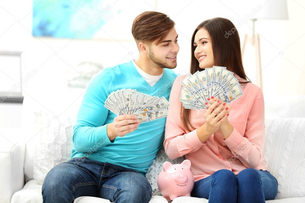 Happy couple counting money
