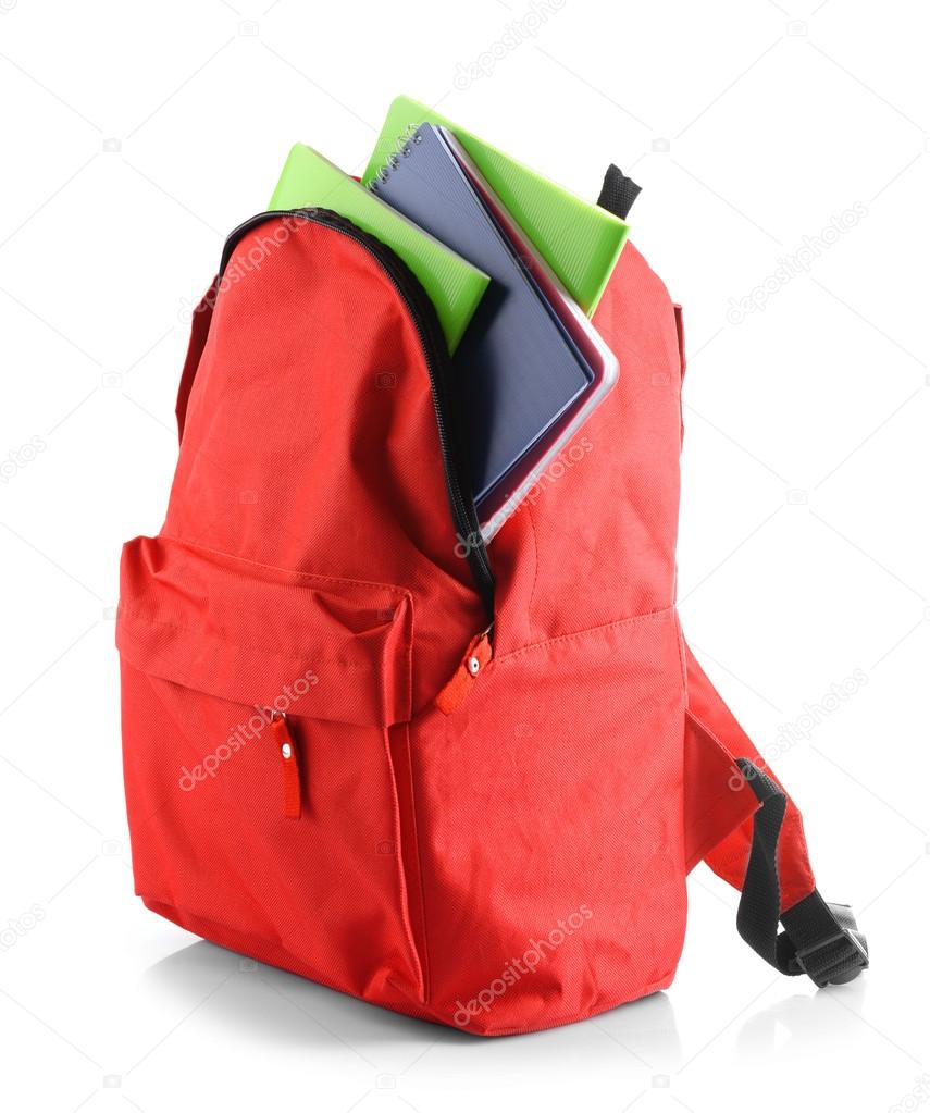 Red backpack with colourful notebooks isolated on white background