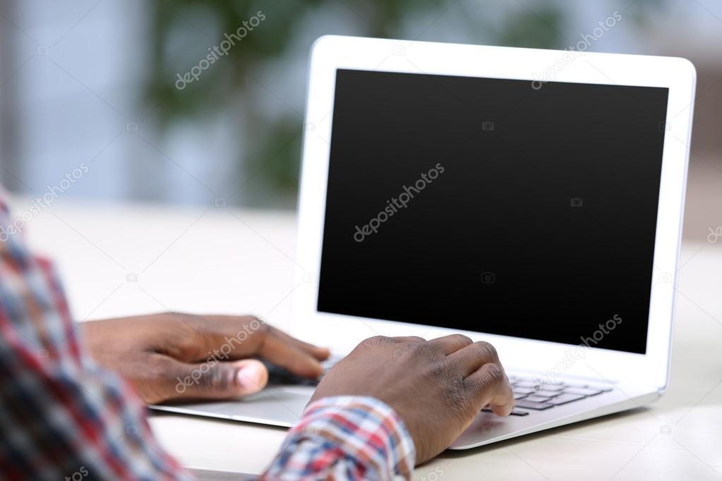 Handsome businessman with laptop