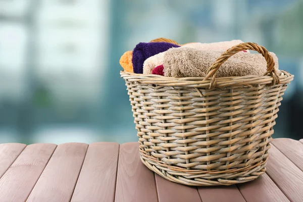 Colorful towels in basket — Stock Photo, Image