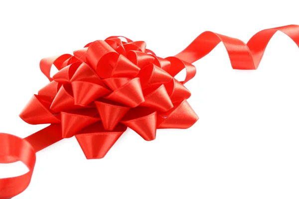 Red bow with curved ribbon isolated — Stock Photo, Image