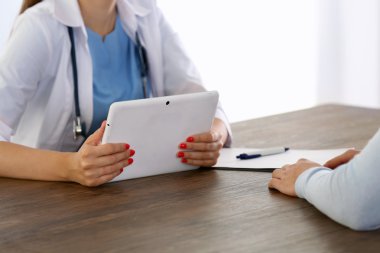 Doctor holding tablet 