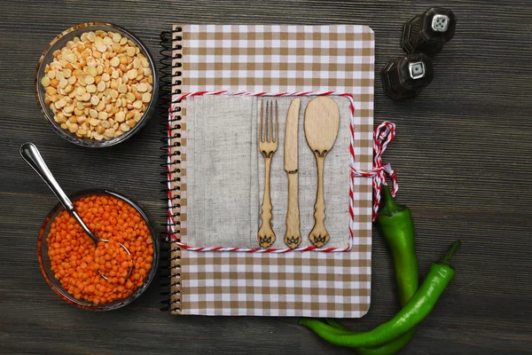 Decorated cookbook on wooden background — Stock Photo, Image