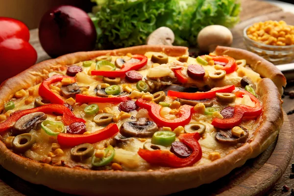 Delicious pizza with vegetables and slice on shovel, close-up — Stock Photo, Image