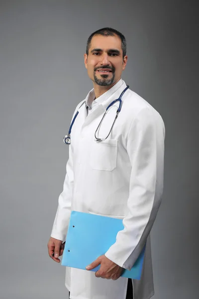 Doctor with prescription board in hands — Stock Photo, Image