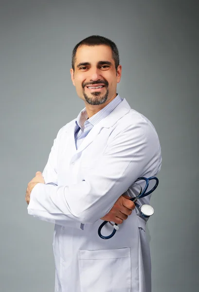 Doctor on grey background — Stock Photo, Image