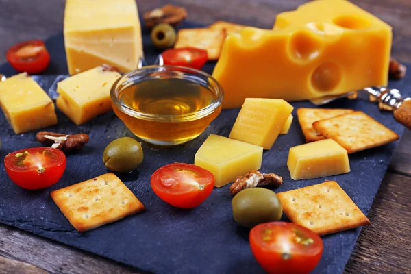 Cheese for tasting on a mat closeup — Stock Photo, Image