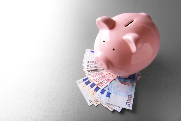 Pig moneybox and euro banknotes — Stock Photo, Image