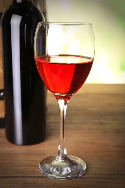 Red wine in glass and in bottle — Stock Photo, Image