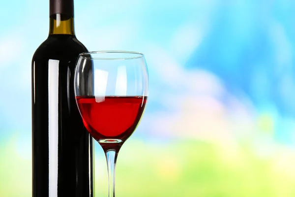 Wine on blurred natural background — Stock Photo, Image