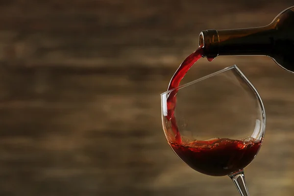 Red wine pouring in a glass Stock Picture