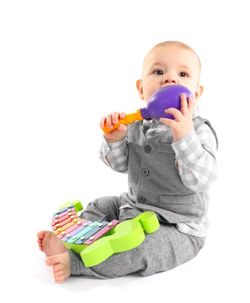 Adorable bebé con xilófono colorido de plástico — Foto de Stock