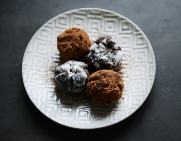 Chocolate balls with ash berry on plate, top view — Stock Photo, Image