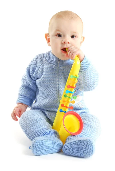 Adorable baby with plastic colourful saxophone — Stock Photo, Image