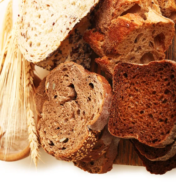 Sliced bread and ears isolated on white — Stock Photo, Image