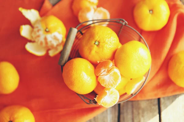 Tangerines on old wooden table, close up — Stock Photo, Image