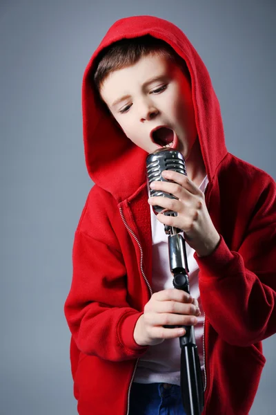 Little boy singing with microphone — Stock Photo, Image