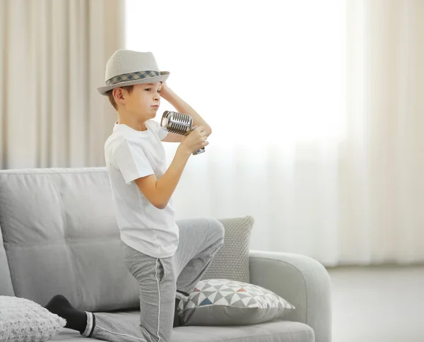 Little boy in hat with microphone — Stock Photo, Image