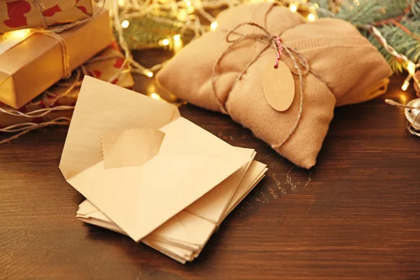 Christmas envelope with pullover gift — Stock Photo, Image