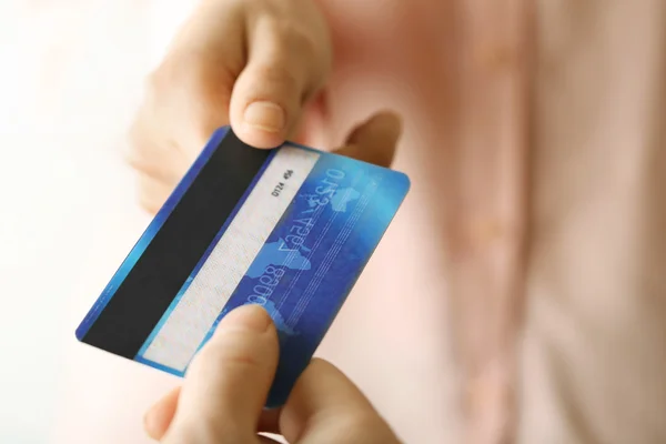 Hands holding blue credit card — Stock Photo, Image