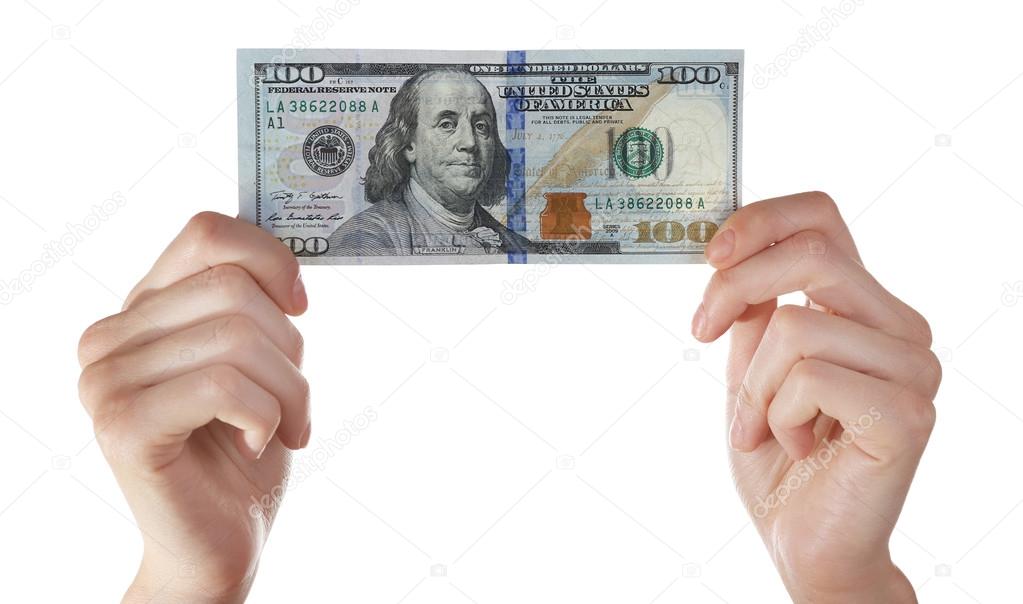 Hands holding hundred dollar banknote