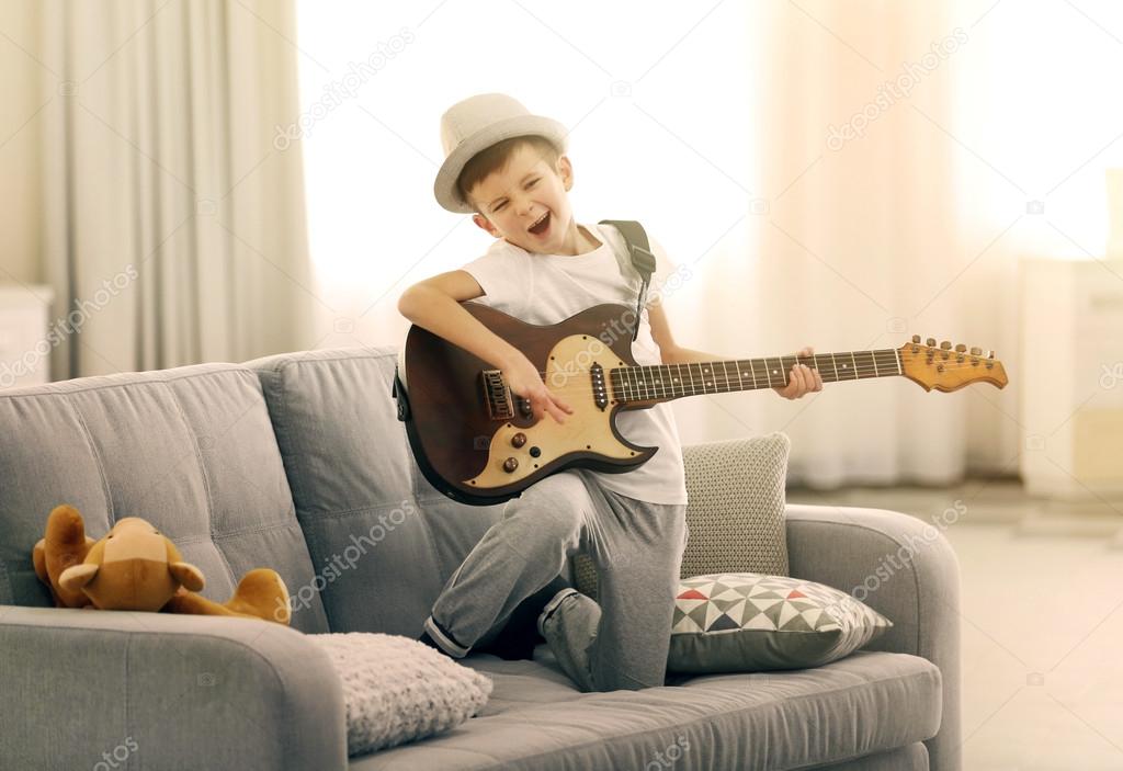 boy playing guitar 